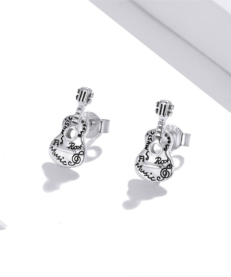 Clou d'oreille guitare pour homme