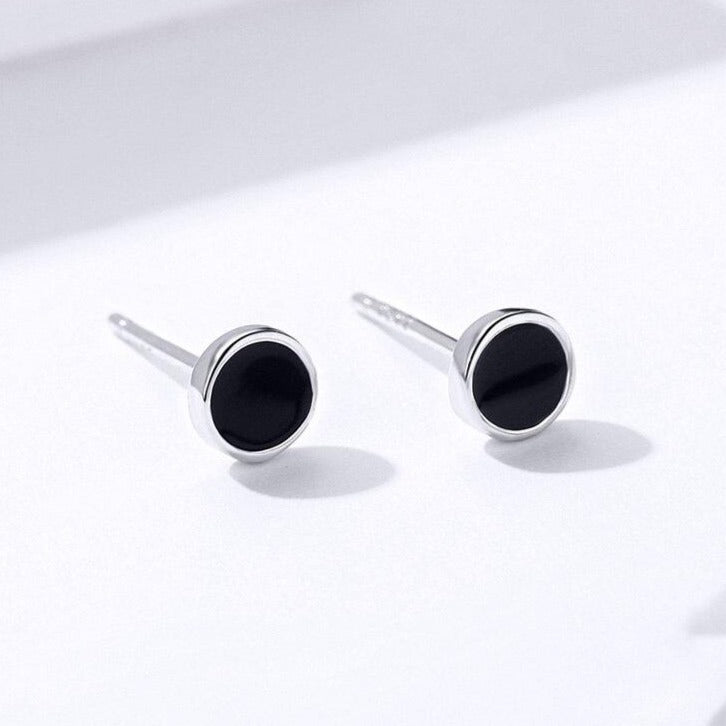 puces d'oreilles homme noir